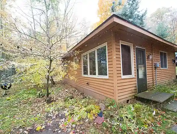Cottage steps and deck on the Pioneer grounds in autumn
