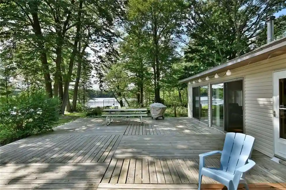 The large deck and glassed porch of the Island Cabin